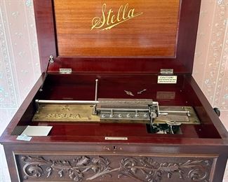 Carved Mahogany Case with Stella Disc Music Box. Includes Base.  additional discs are included.    This music box has the most amazing sound!  