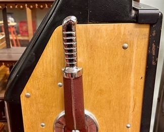 Here's an old antique Five Cent "One Arm Bandit" with a "guaranteed $7.50 payout" by Mills