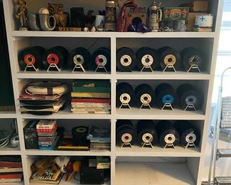 Shelf full of promo 45's from when owner was a part time disk jockey at the local country station.