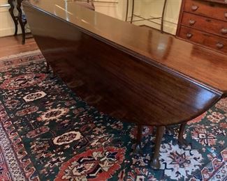 Long drop leaf casket table.