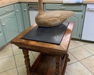 Pretty table with odd wood duck.