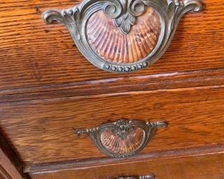 Glasbake handles on oak dresser.