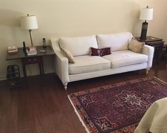 SOFA IN MASTER BEDROOM, RUG AND TABLES,AND LAMPS