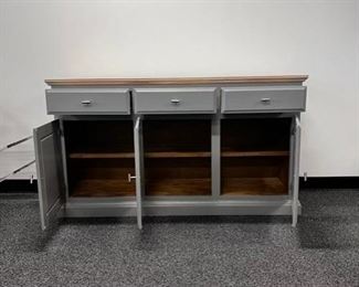 $180 USD     Modern Light Grey Buffet Media Center Sideboard Console Table MTF153-19      Freshly painted light grey modern sideboard/buffet/media center with stainless hardware.  Perfect piece for multi functional opportunity! Light wood top for an updated appeal.

58 x 17 x 32.5H in

Used and in excellent condition.

Local pick up Portland, OR.  Please contact us for shipping suggestions.     https://goodbyhello.com/products/copy-of-mastercraft-brass-glass-display-cabinet-mtf153-18?_pos=4&_sid=bc82b42b8&_ss=r