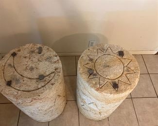 Sun and moon on top of table columns. 