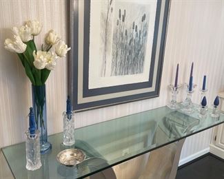 Mid-Modern stainless and glass console table, Vintage Orrefor candle holders and framed/signed lithograph