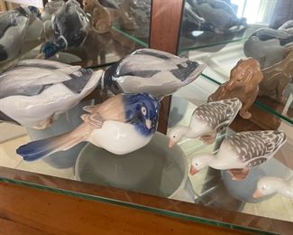 Royal Copenhagen figurines: geese, ducks, dog, and bird