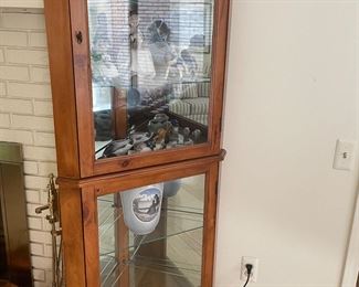 Corner lit curio cabinet with glass shelves