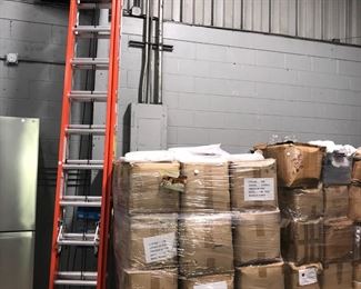 Pallets of Table Linens and Extension Ladders