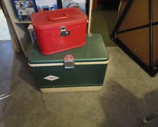 Little red suitcase on vintage cooler