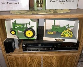 John Deere toy tractors in boxes, VHS player