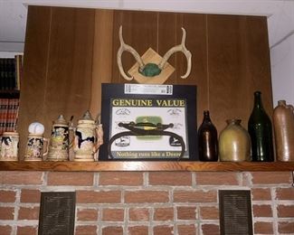 Vintage beer steins, antler mount, John Deere sign, stoneware & vintage bottles