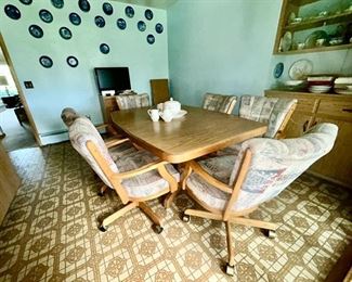Vintage Dining room table with 6 chairs on wheels