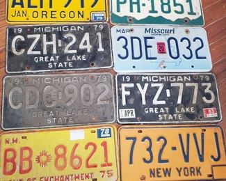 Numerous vintage lisence plates...