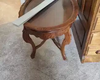 Oval glass-top coffee table