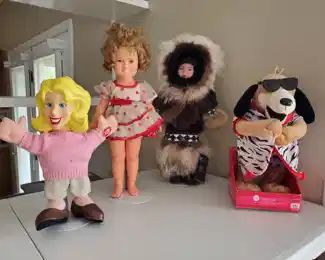 Large Shirley Temple doll, Eskimo doll in a fur coat, etc.