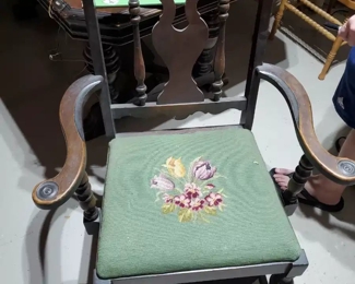 There are (6) needlepoint 30's chairs (1) captains chair in the basement