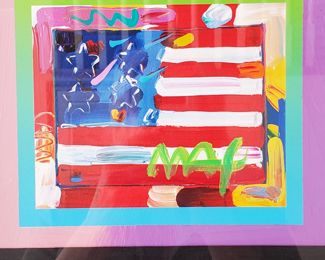 TO BID go to:        https://www.EstateSales.NET/MO/Saint-Louis/63141/marketplace/57517                                                                                                                                                          Peter Max Liberty  'Flag on Blends - Horizontal' hand signed in acrylic by the artist. (American Suite) 2005 8" x 10". Mixed media with acrylic painting and color lithography on paper. This work of art is part of a two-piece suite. Framed 24" x 24"