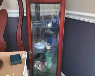 Curio cabinet is approx 3' tall x 20" w