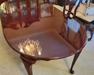Queen Anne dining table with (7) chairs (1) chair in basement needs repair