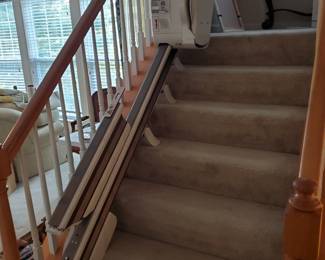 Used....but in great condition!  The stair lift, on the first group of steps up to the landing, opens out onto the 1st floor.