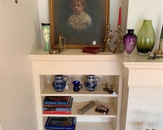 Living Room 
Art books
Brass cherub candlesticks 
Stoneware 
Painting