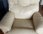 Lancer rocker/recliner is  a pretty cream leather. Manual operation. 
