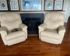 Set of two leather Lancer rocker/recliners, made in USA. One is electric; one is manual
