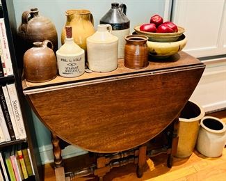 Drop leaf table and ceramic jugs