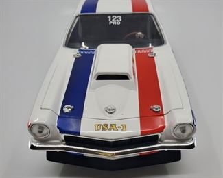 Lot 002-MT: 1972 Bruce Larson USA-1 Vega Die-cast

Features:
•	#9 out of 1008

Manufacturer: ERTL
Mfg. Year: N/A
Scale: 1:25
Country of Origin: China
Color: White
Material: Diecast Metal with some plastic parts
Condition: Good Pre-owned; No box.
