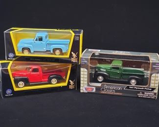 Lot 030-MT: Die-cast Pickup Trio #2

Features:
•	Lucky Die Cast 1953 Ford F-100 Pickup
•	Lucky Die Cast 1950 GMC Pickup
•	Motor Max 1941 Plymouth Pickup


