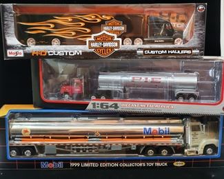 Lot 033-MT:  Die-cast “Semi” Trio #2

Features:
•	Mobil 1999 Limited Edition Collector’s Toy Truck with Diecast Tractor Cab, no. 7
•	Pacific Intermountain Express Diecast Metal Replica, no. 60-0318
•	Harley Davidson Diecast Haulers, #11516

