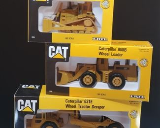 Lot 034-MT: CAT Die-cast Work Equipment Trio #2

Features:
•	Caterpillar Diecast 631E Wheel Tractor Scraper, no. 2430
•	Caterpillar Diecast 988B Wheel Loader, no. 2435
•	Caterpiller Diecast D10N Track-Type Tractor, no. 2436
