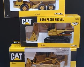 Lot 035-MT: CAT Die-cast Work Equipment Trio #3

Features:
•	CAT Diecast D11R Track-Type Tractor, no. 55025
•	CAT Diecast 5080 Front Shovel, no. 2676
•	Caterpillar Diecast D350D Articulated Dump Truck, no. 2431

