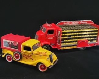 Lot 043-MT: Coca-Cola Die-cast Duo #3

Features:
•	Danbury Mint Diecast 1935 Ford Coca-Cola Delivery Truck with Coke Vending Machine
•	Danbury Mint Diecast 1938 GMC Coca-Cola Delivery Truck with Coke Cases

