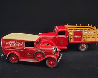 Lot 045-MT: Budweiser Die-cast Delivery Truck Duo

Features:
•	Danbury Mint 1931 Anheuser-Busch Yeast Budweiser Barley Malt Syrup Delivery Truck
•	Danbury Mint 1930s Anheuser-Busch Budweiser Delivery Stake Truck with Barrels
