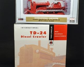Lot 049-MT: International Harvester Die-cast Duo #2

Features:
•	SpecCast Diecast International Harvester TD-24 Crawler with Cable Blade, #ZJD 1844
•	SpecCast Diecast International Harvester TD-24 Diesel Crawler with Superior Pipe Layer, #ZJD 1534

