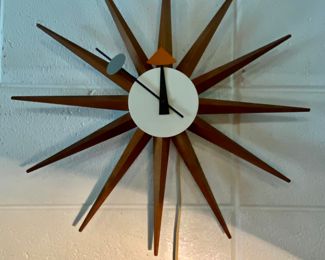 George Nelson designed  for Howard Miller Iconic Mid Century modern Sunburst clock quickly became one of the many timepiece icons of the 20th century.  Its decorative nature and lack of numbers  create an unexpected design that offers colorful decoration yet remains fully functional.  Original in EUC.