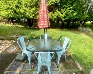 4 chairs, glass top table and umbrella