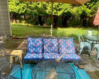Chair with matching round coffee table and cushioned sofa
