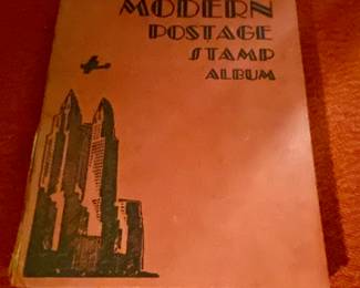 Postage stamp album with stamps