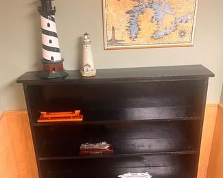 Wooden bookshelf and lighthouses, plus some ships 