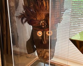 Superb Wobe style African mask with feathered headdress in display case.