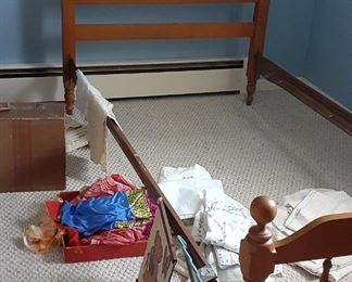 Twin bed, old suitcase, twin sheets