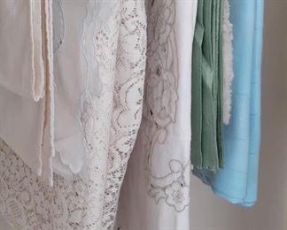 lotsm of linens and table cloths