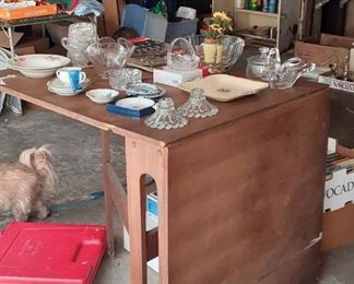 Unusual dropleaf table.  One leaf is down.... Definitely space saving