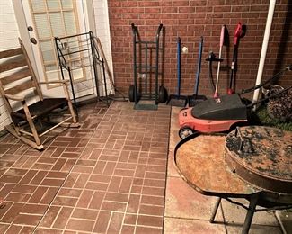 VARIETY OF YARD AND GARDEN TOOLS, CAST IRON GRILL AND ELECTRIC LAWN MOWER.
