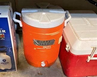 NEW PUMP SPRAYER, ICE CHEST AND WATER COOLER.