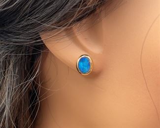 Shimmering Play-of-Color Blue Opal Oval Inlay Bezel Stud Earrings in 14k Yellow Gold
