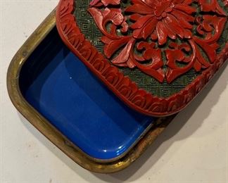 Cinnabar jewelry box with jade background and blue lacquer inlay.